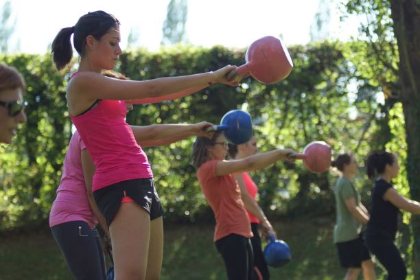 Group training outdoor kettlebell swing